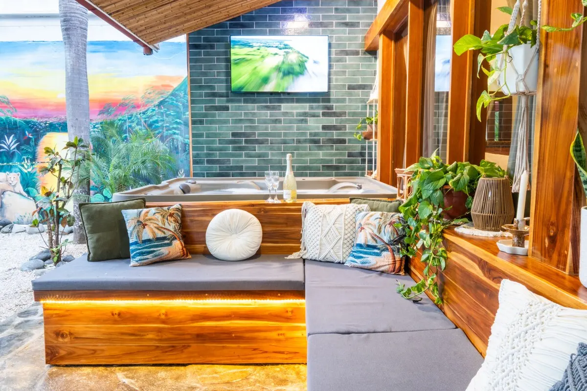 Lounge seating beside the hot tub with smart TV