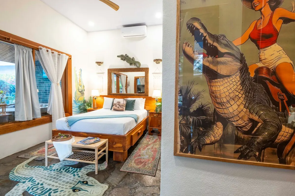 Crocodile Room with queen bed and crocodile mural