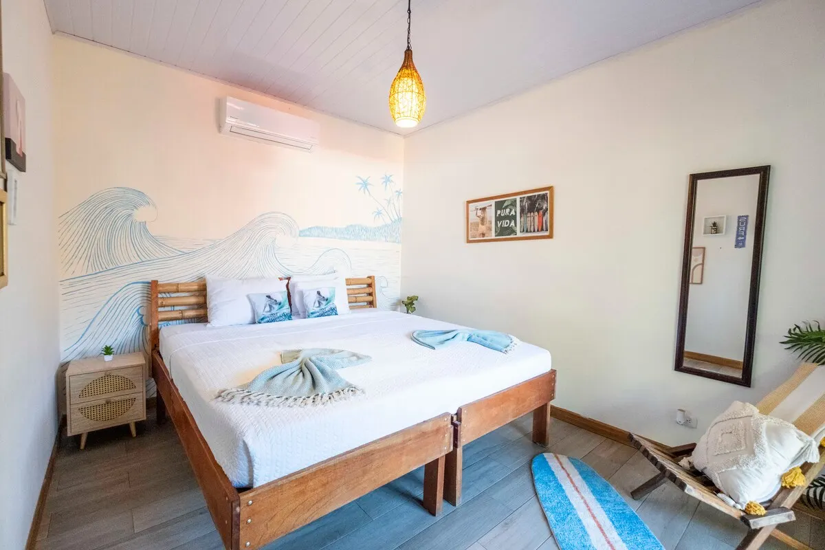 Surfer's Paradise bedroom with wave mural