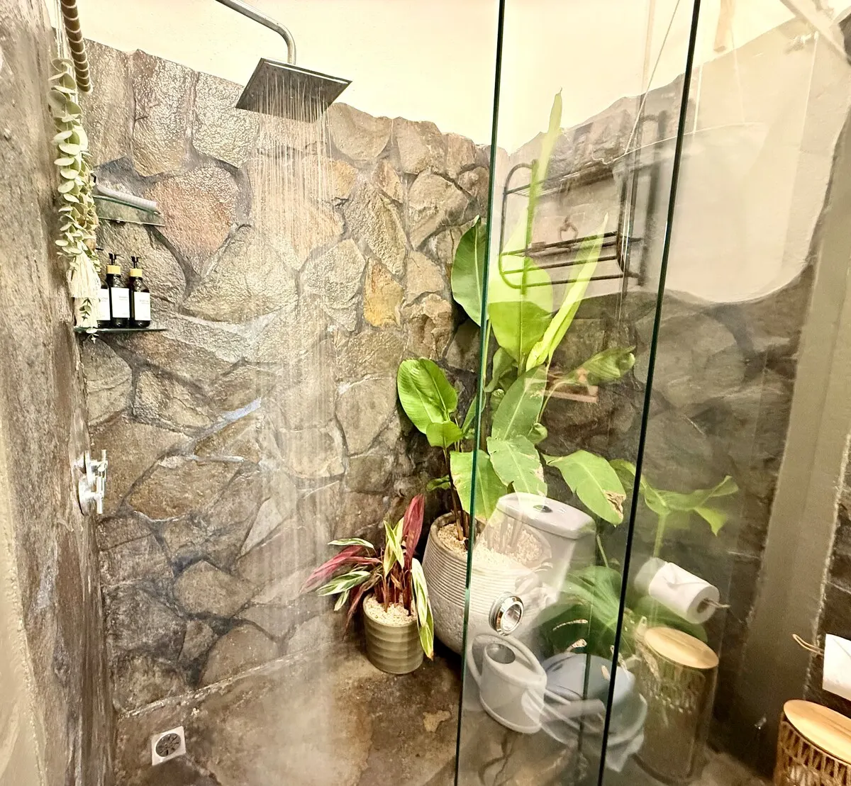 Rainfall shower in stone bathroom