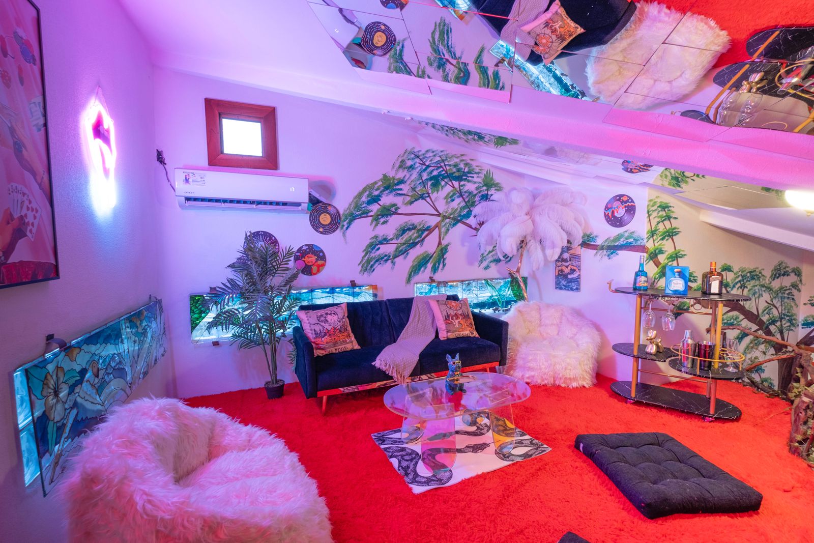 Lounge with mirrored ceiling and red shag carpet