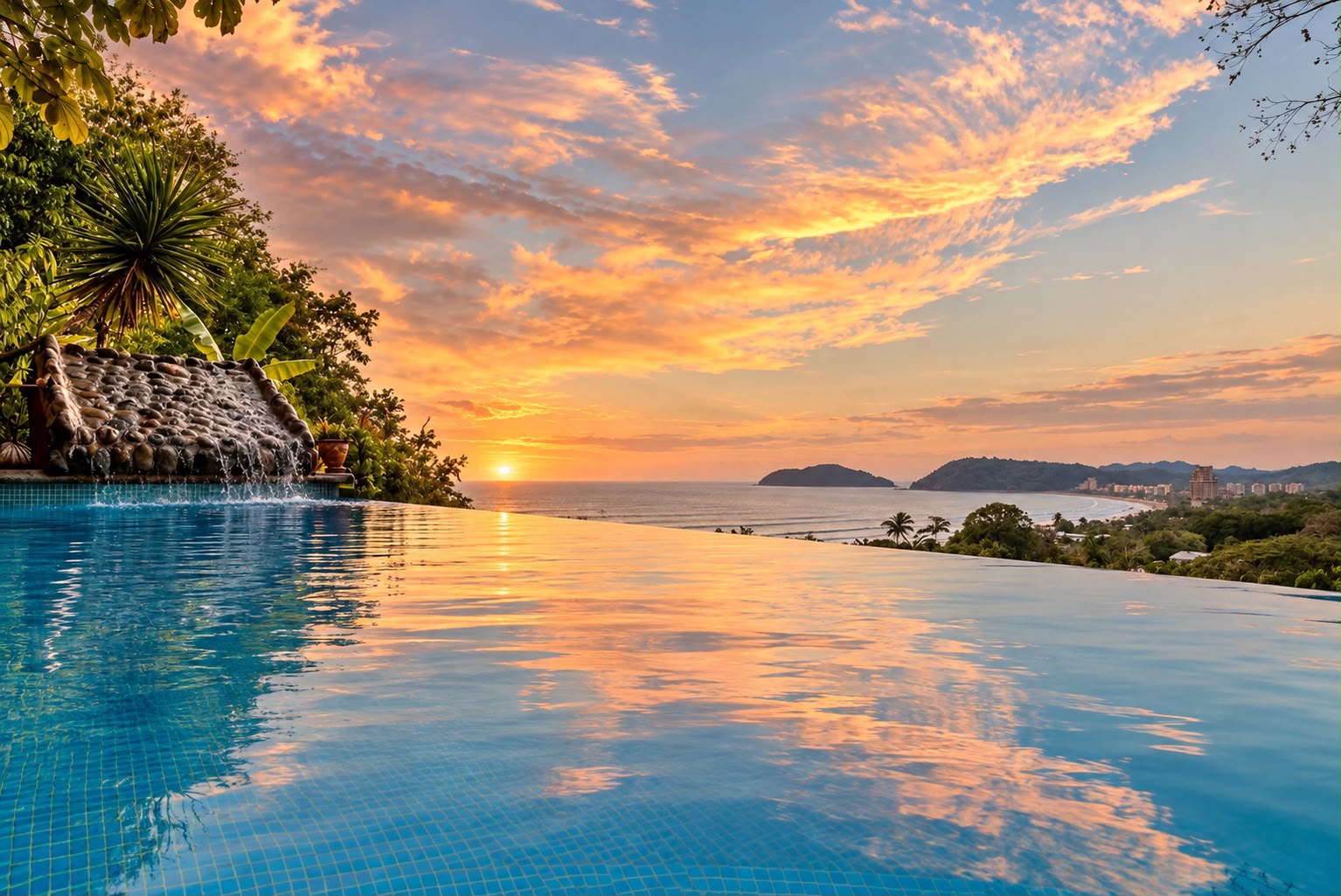 Infinity pool reflecting the sunset sky