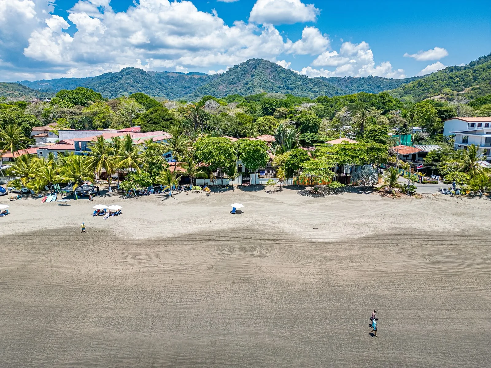 Beach and green mountains near Villa Montine